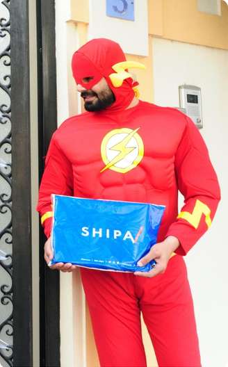 A superhero from Shipa delivery delivering the cargo 